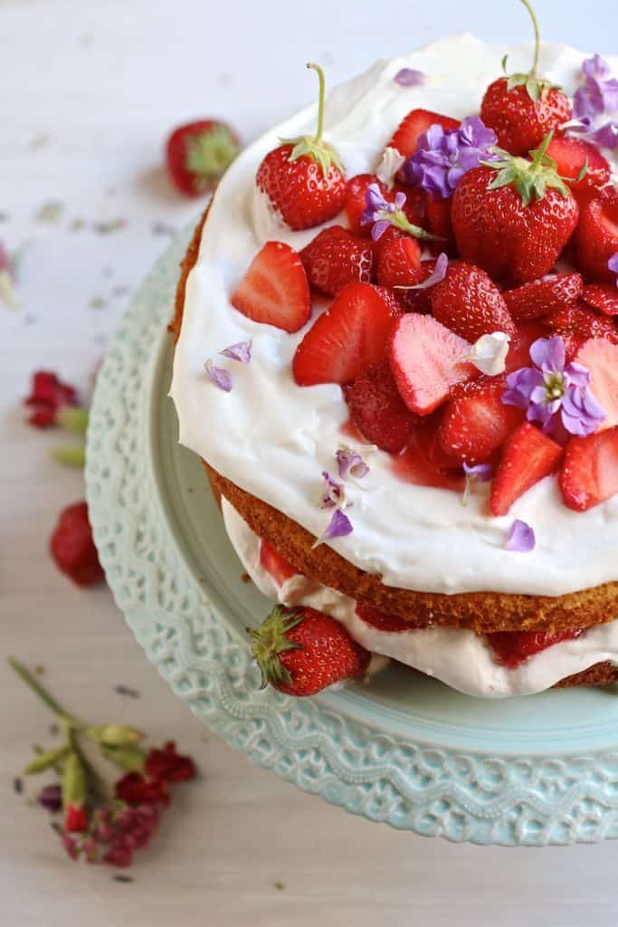 strawberry almond cake on a serving platter