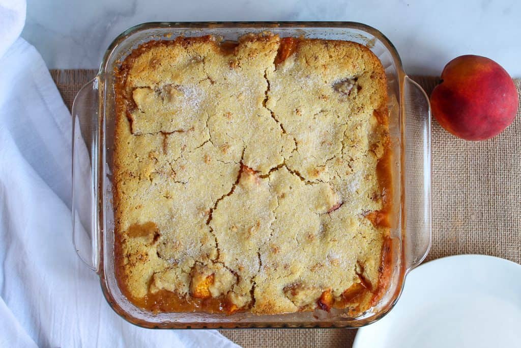 gluten free peach cobbler in a baking dish.