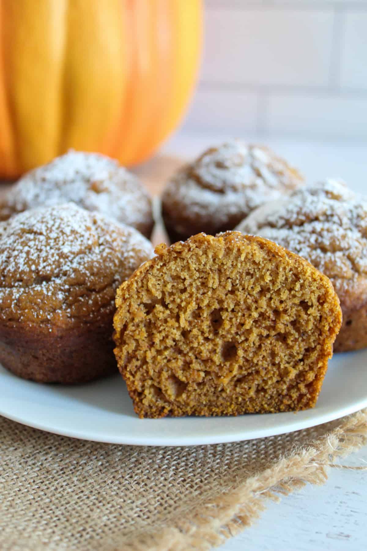 inside of a pumpkin muffin on a white plate