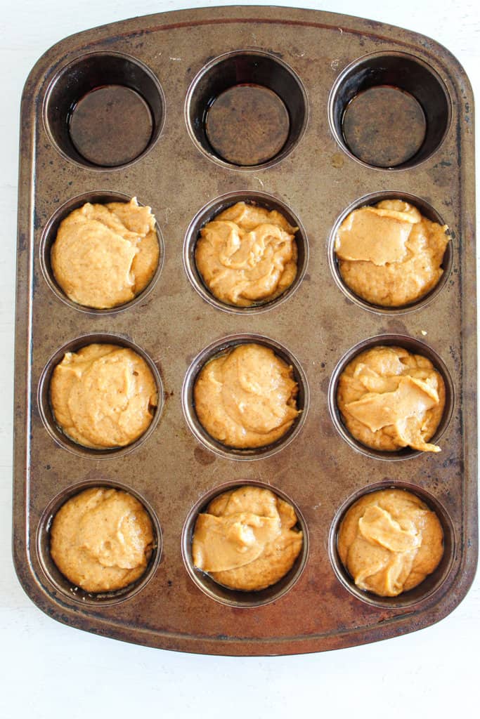 muffin batter portioned in a pan.