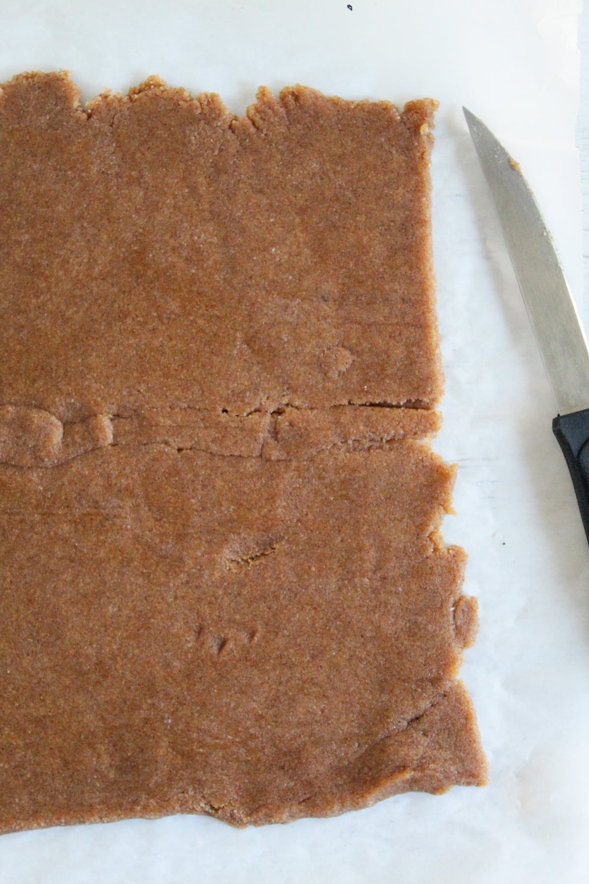 rolling graham cracker dough out