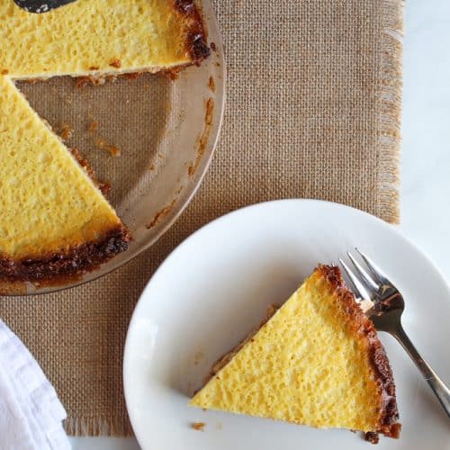 slice of gluten free buttermilk pie on a white plate