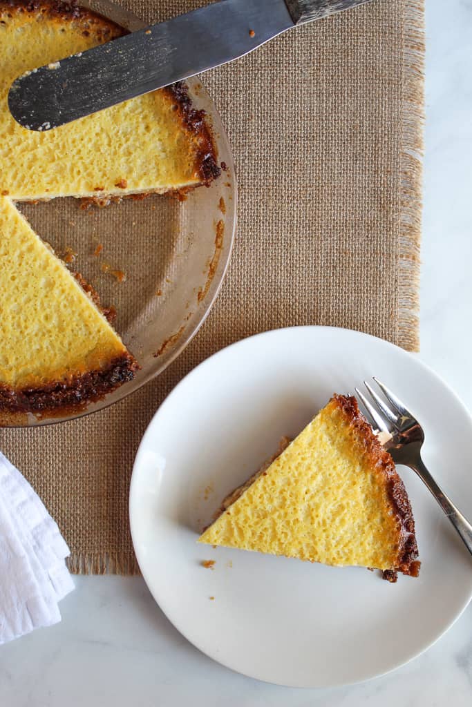 slice of gluten free buttermilk pie on a white plate