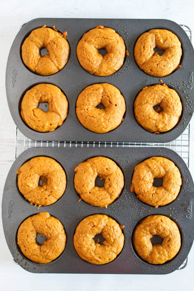pan of baked pumpkin donuts.