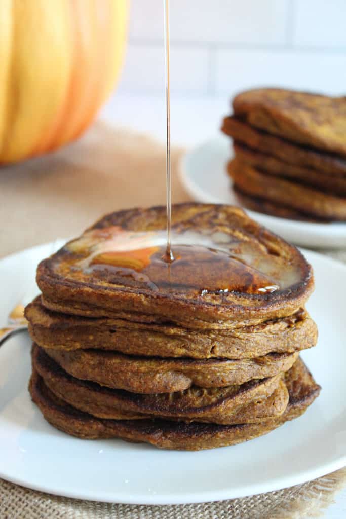 syrup pouring onto gluten free pumpkin pancake 