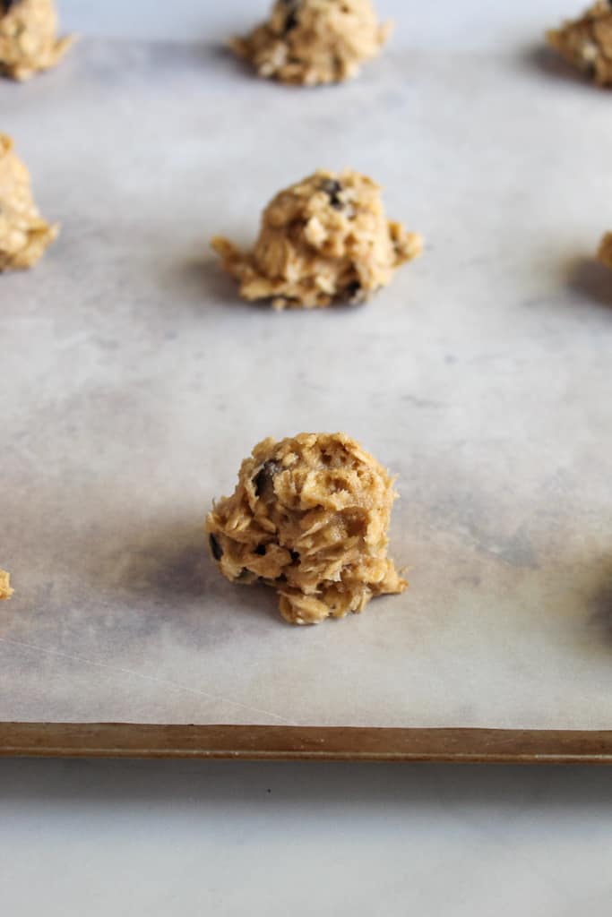 gluten free oatmeal raisin cookies on a cookie sheet before baking
