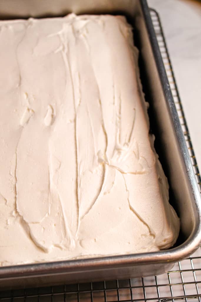 gluten free banana cake frosted in the pan