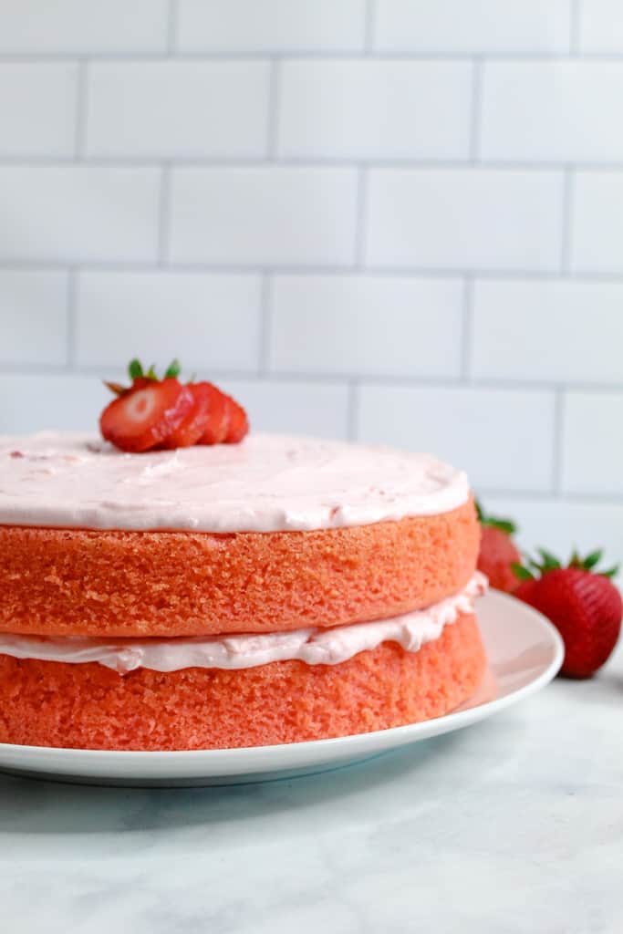 gluten free strawberry cake whole cake on a plate