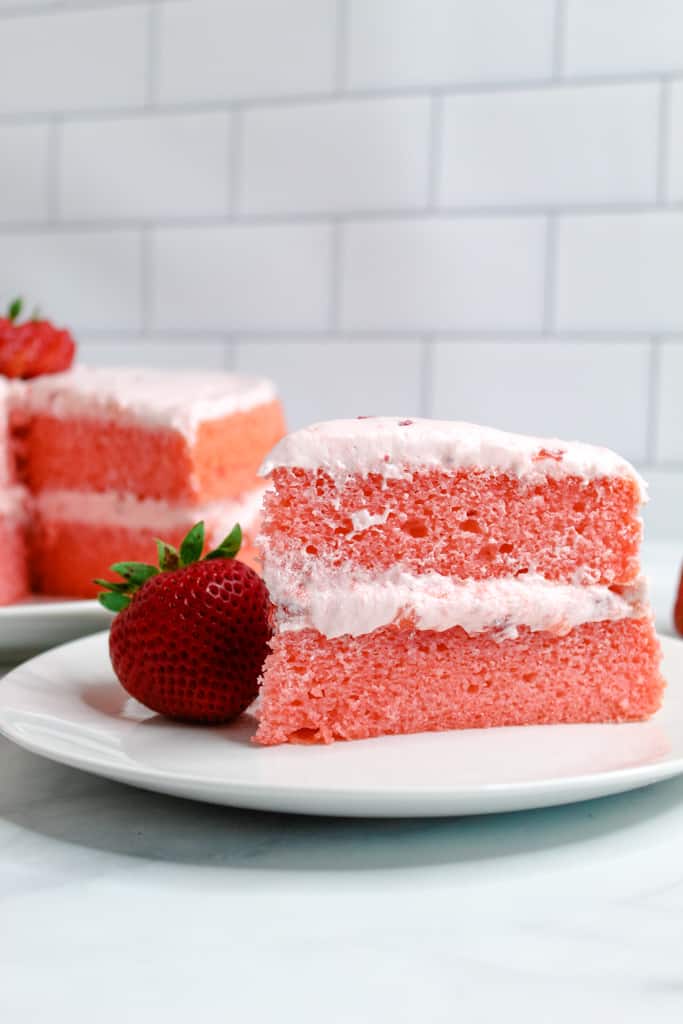 gluten free strawberry cake slice served on a white plate