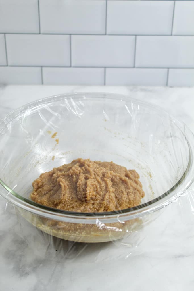 almond flour sugar cookies batter covered with a plastic wrap