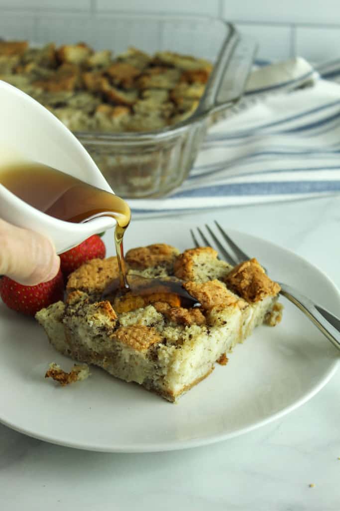 Gluten Free French Toast Casserole pouring syrup