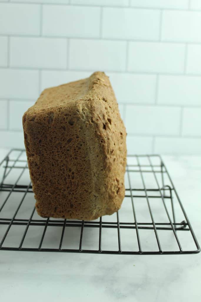 gluten free multigrain bread cooling on its other side