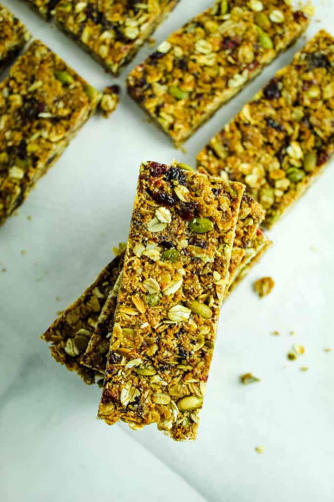 homemade granola bars stacked on a plate