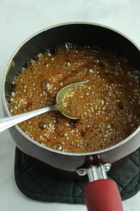 granola bar sugar syrup in a pan