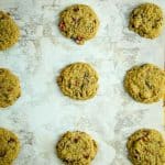 gluten free cranberry cookies baked on a baking sheet lined with parchment paper