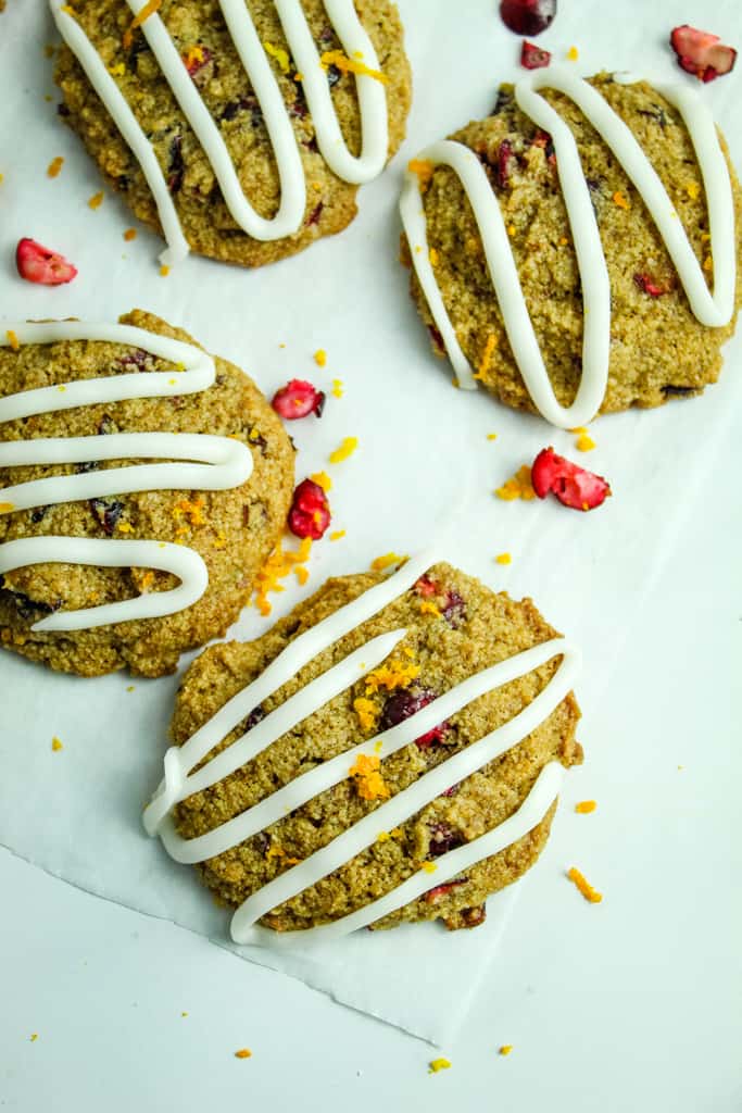 overhead shot of gluten free cranberry cookies on parchment paper