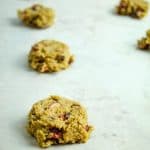 gluten free cranberry cookie dough on baking sheet lined with parchment paper