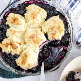 overhead shot of bowl of blueberry cobbler