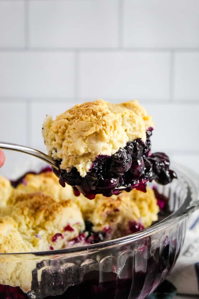 large scoop of blueberry cobbler