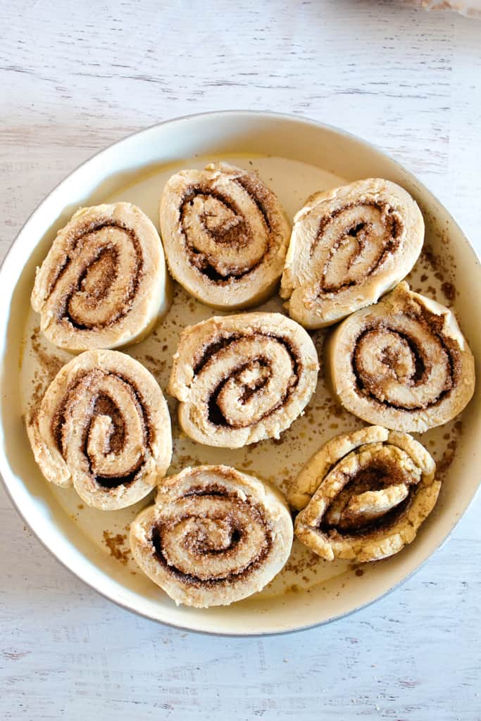 cinnamon rolls in a white pan