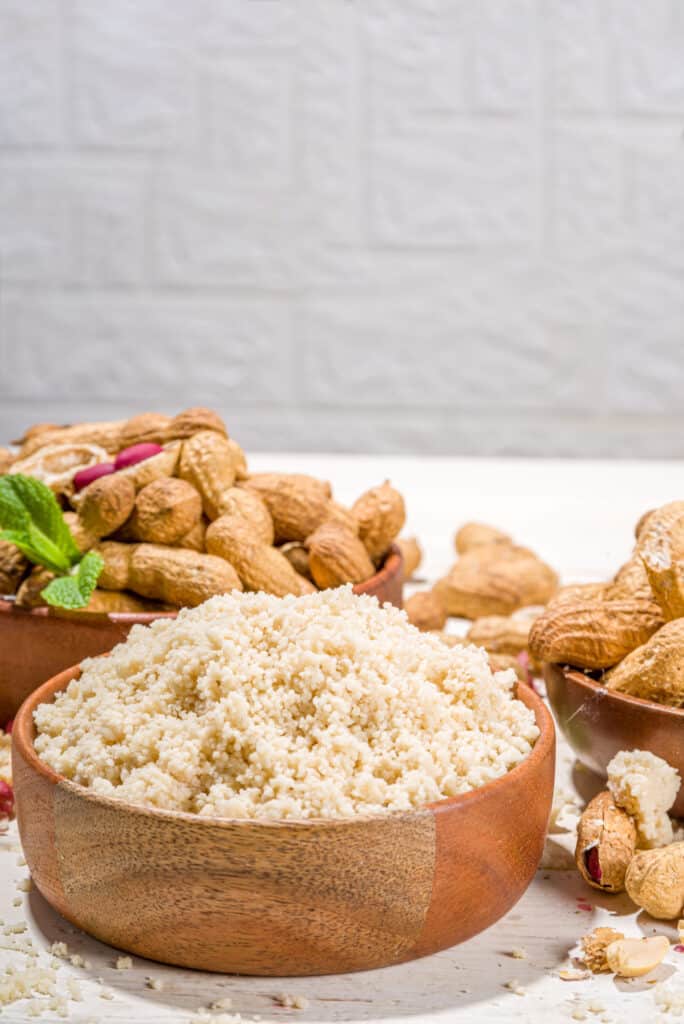 peanut flour in a brown bowl