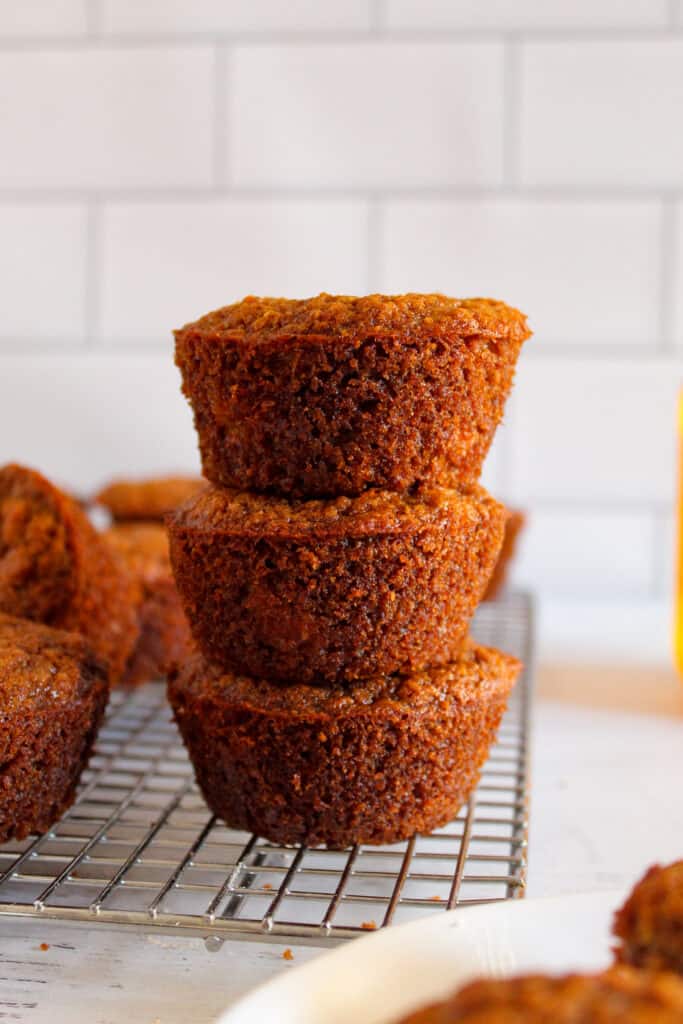 flaxseed muffins stacked on a rack 