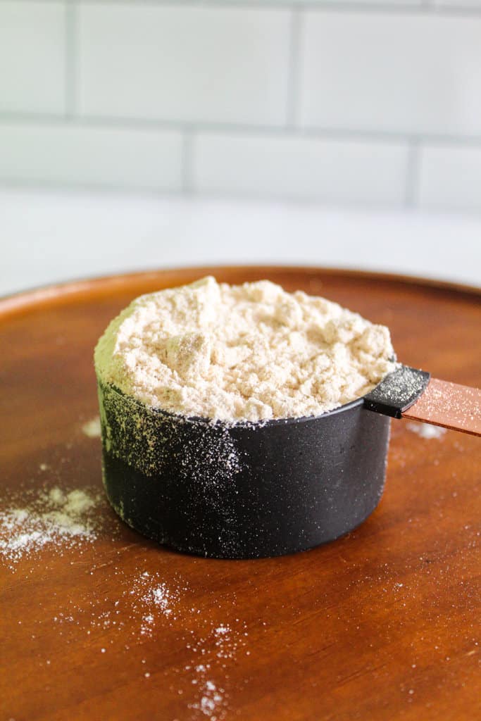 sorghum flour in a measuring cup.