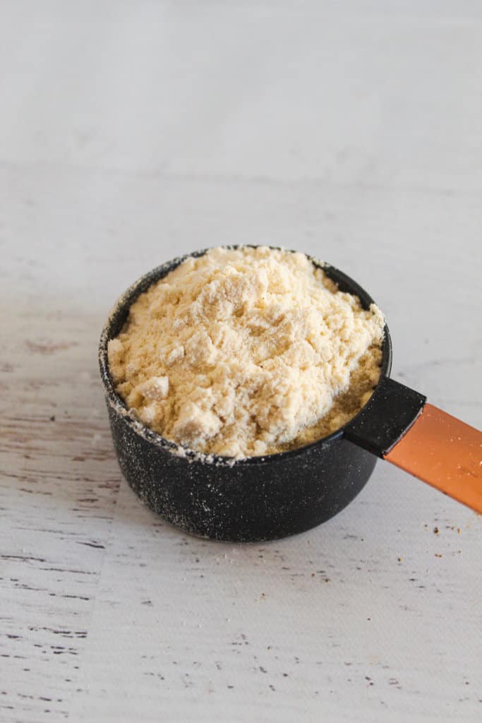 millet flour in a measuring cup