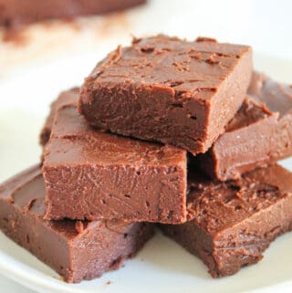 pieces of fudge stacked on a plate.