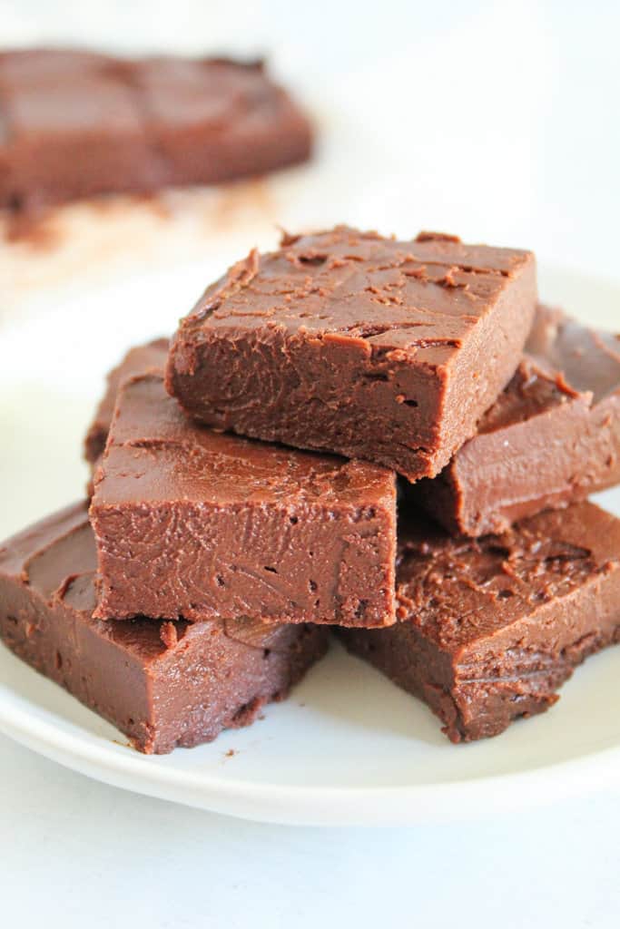 pieces of fudge stacked on a plate.