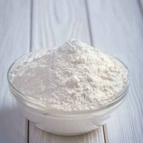 bowl of flour on a counter.