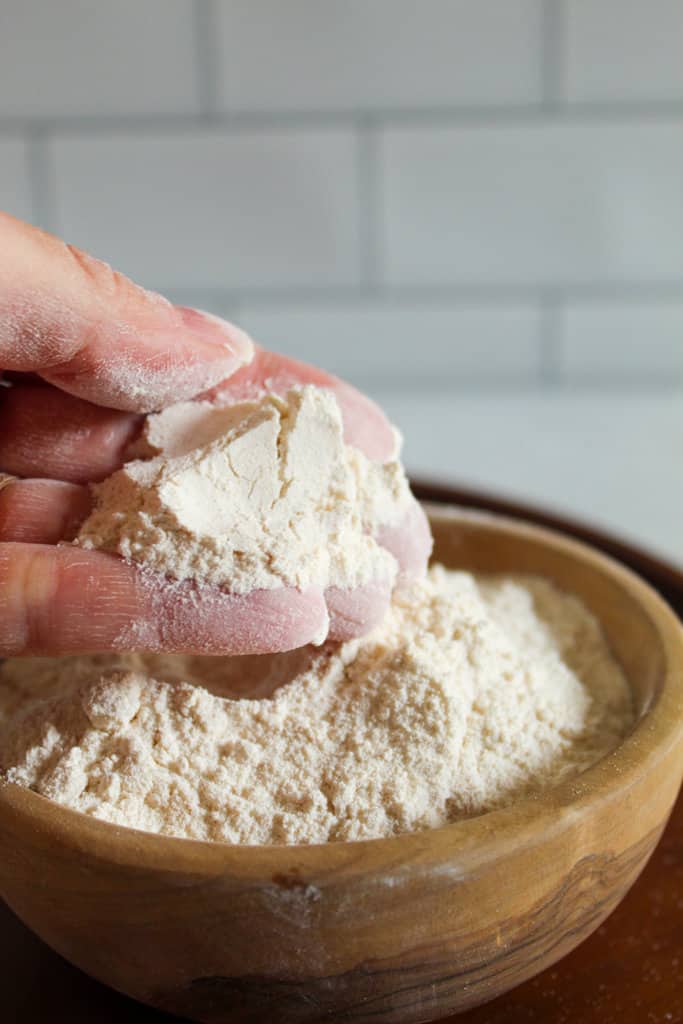 hand holding cassava flour.