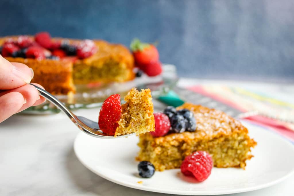 bite of vanilla cake on a fork.