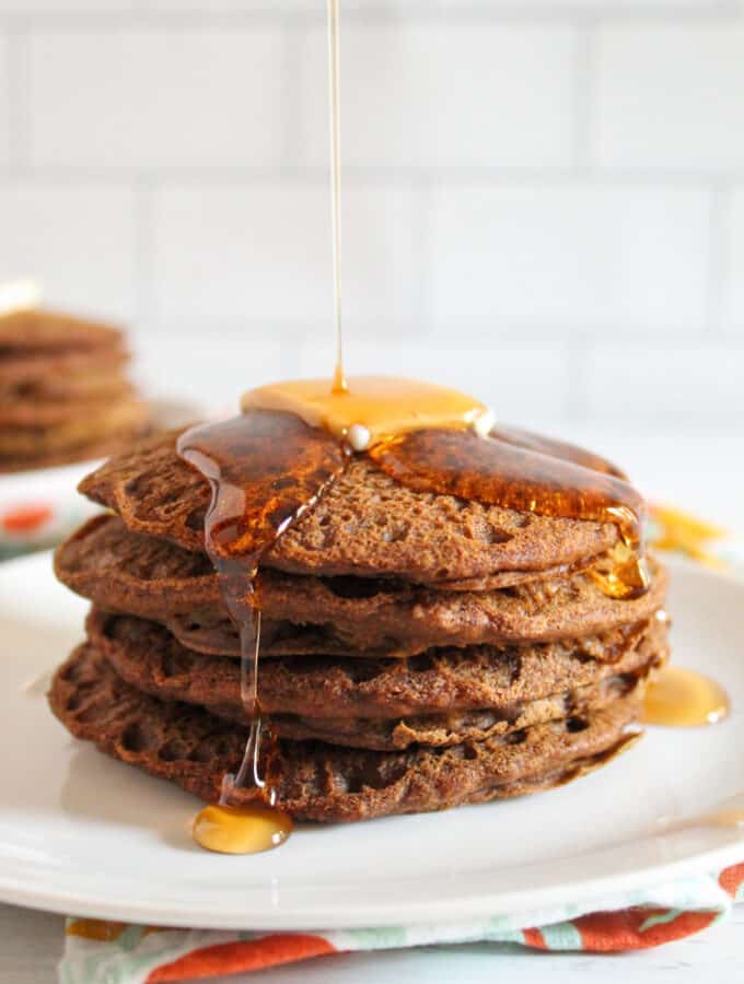 syrup pouring on teff pancakes.