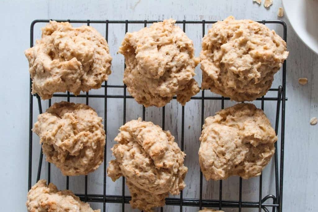 baked oatmeal rolls cooling on a wire rack.