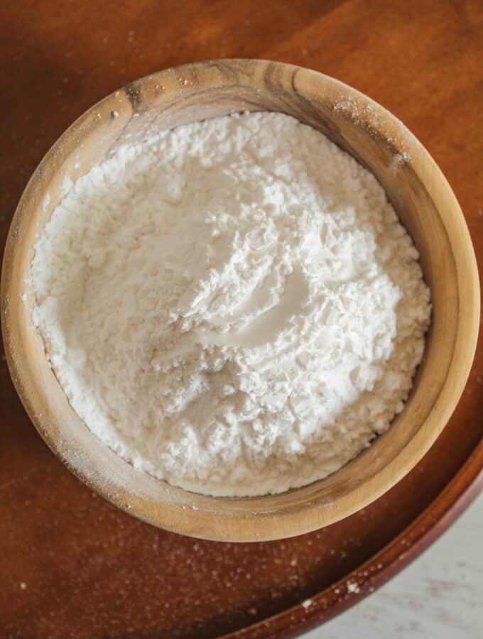 overhead shot of a wooden bowl of tapioca starch.