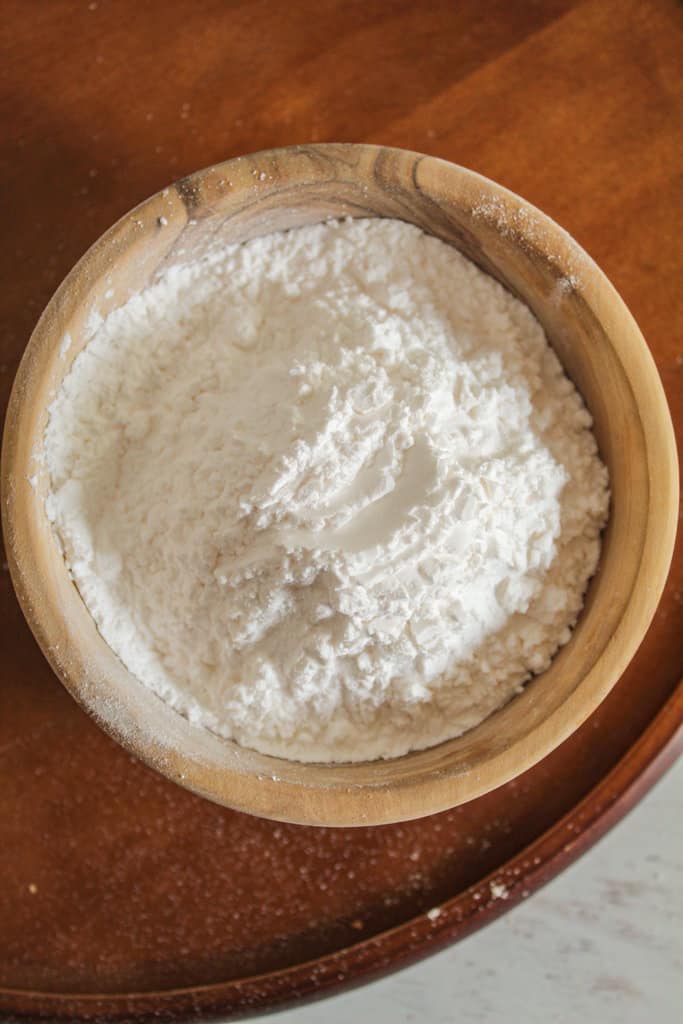 overhead shot of a wooden bowl of tapioca starch.