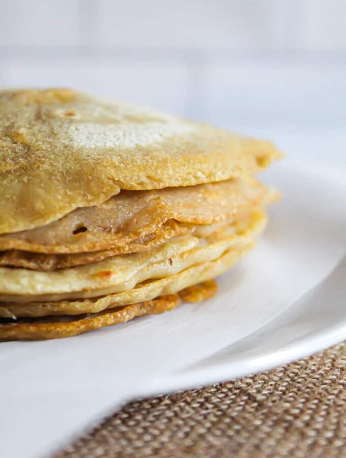 stack of buckwheat crepes on a plate.