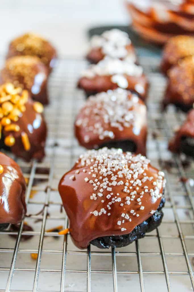 rack of gluten-free oreo truffles all decorated.