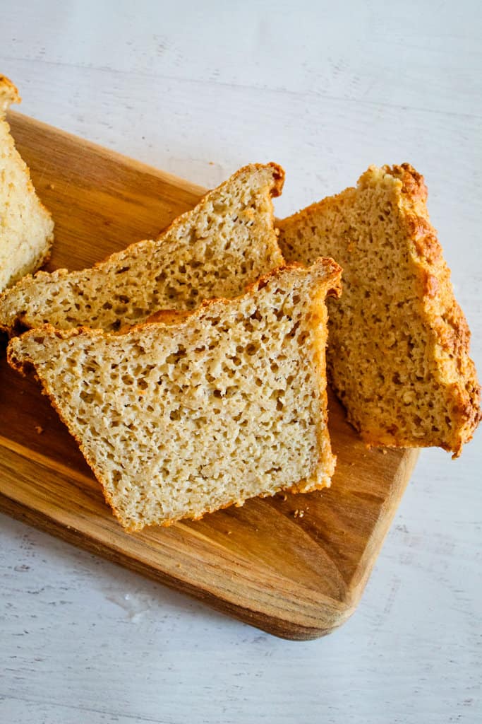 oat bread sliced on a cutting board.