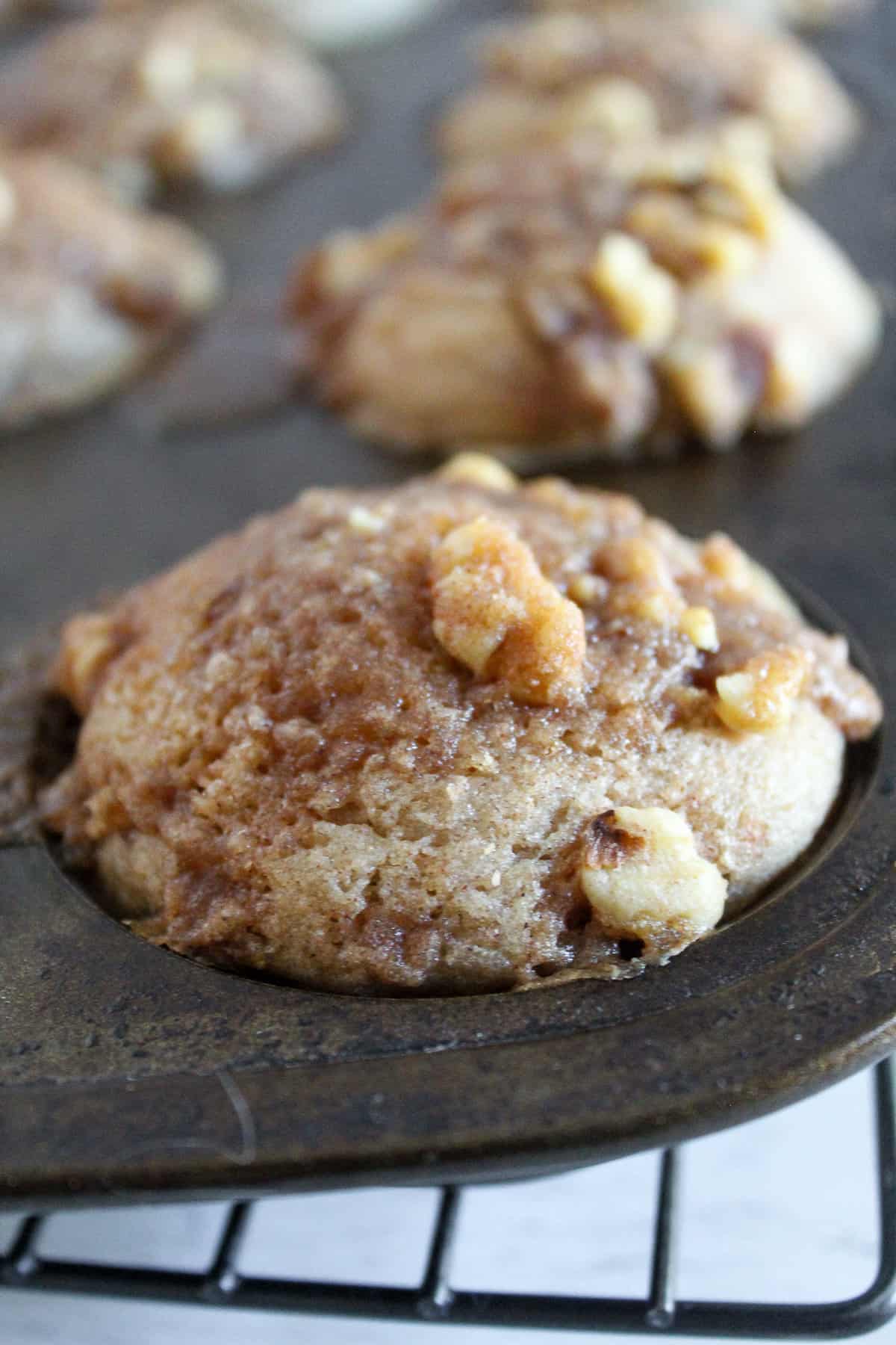 gluten free cinnamon muffin sitting in a baking pan.