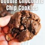 hand holding a gluten free double chocolate chip cookie.