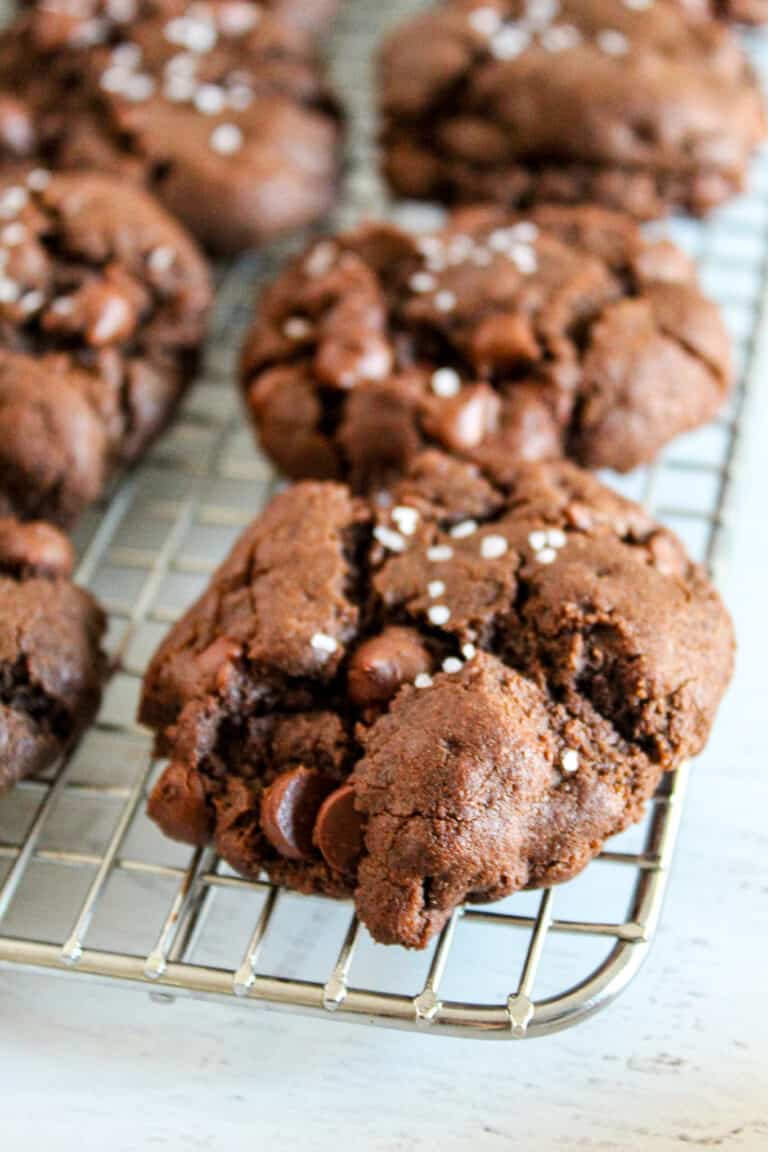 double chocolate chip cookies on a wire rack.