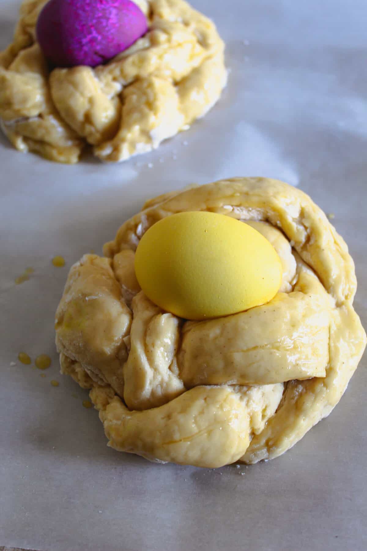 Breaded dough for Easter bread with egg placed in center