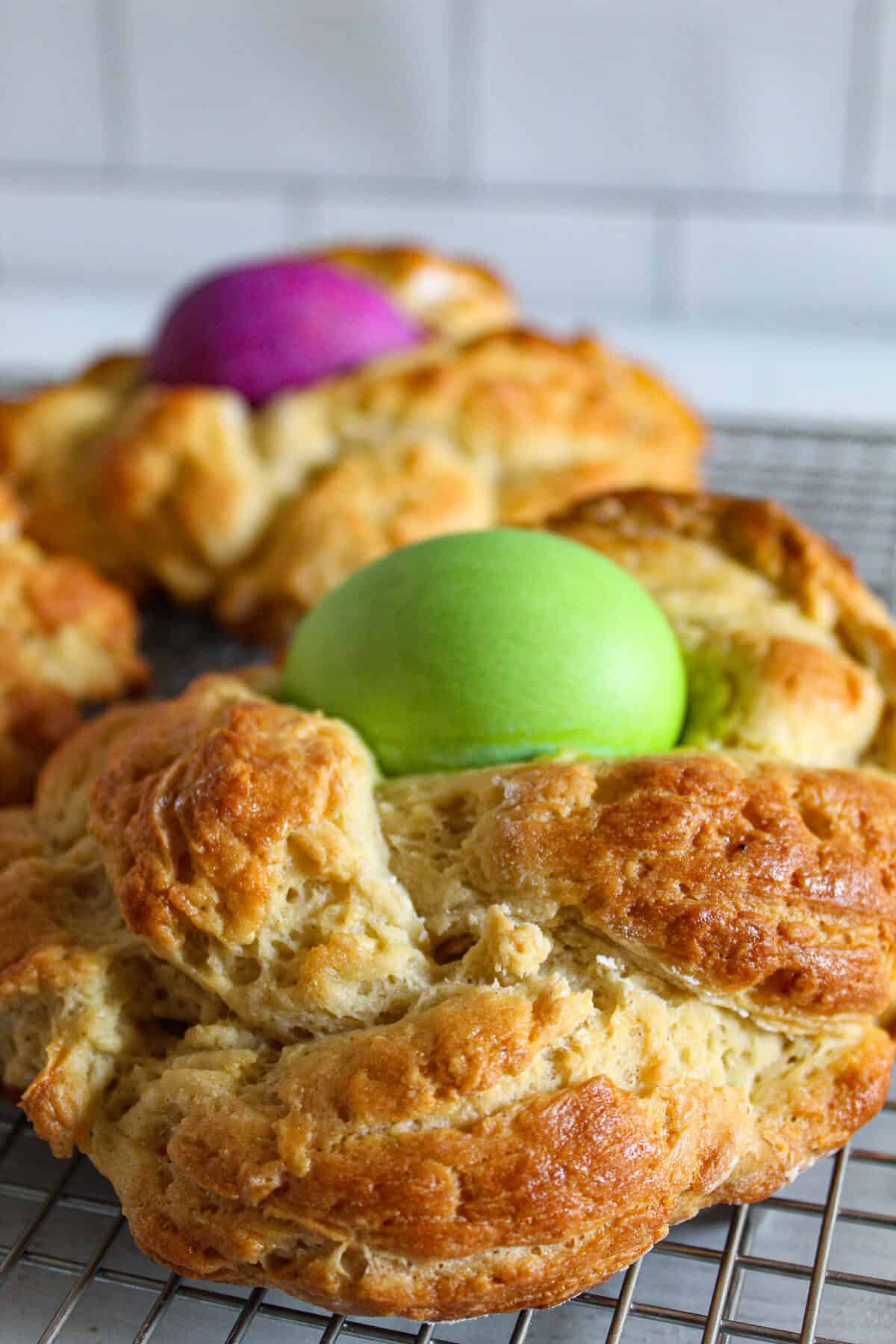 braided easter bread on a wire rack