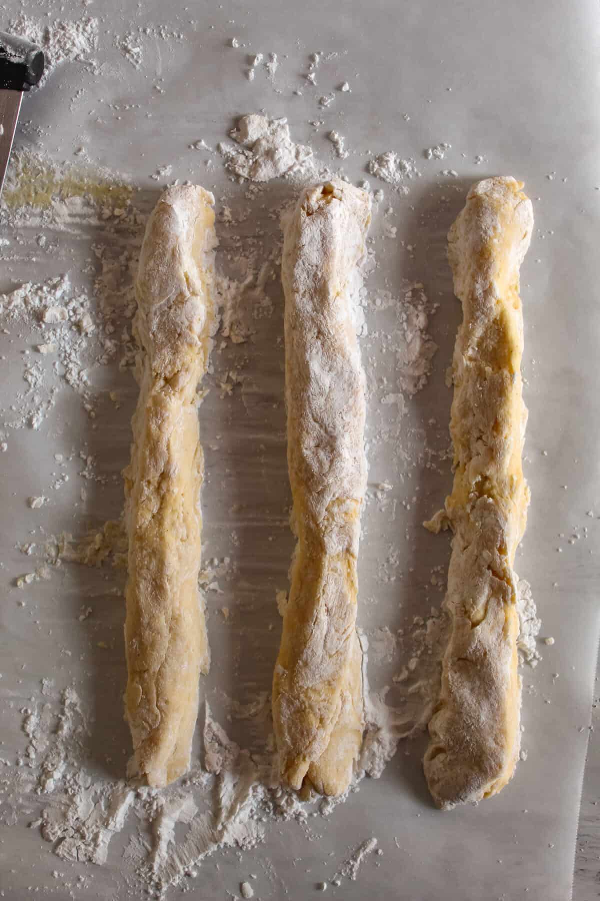 Three equally sized dough cylinders for making easter bread