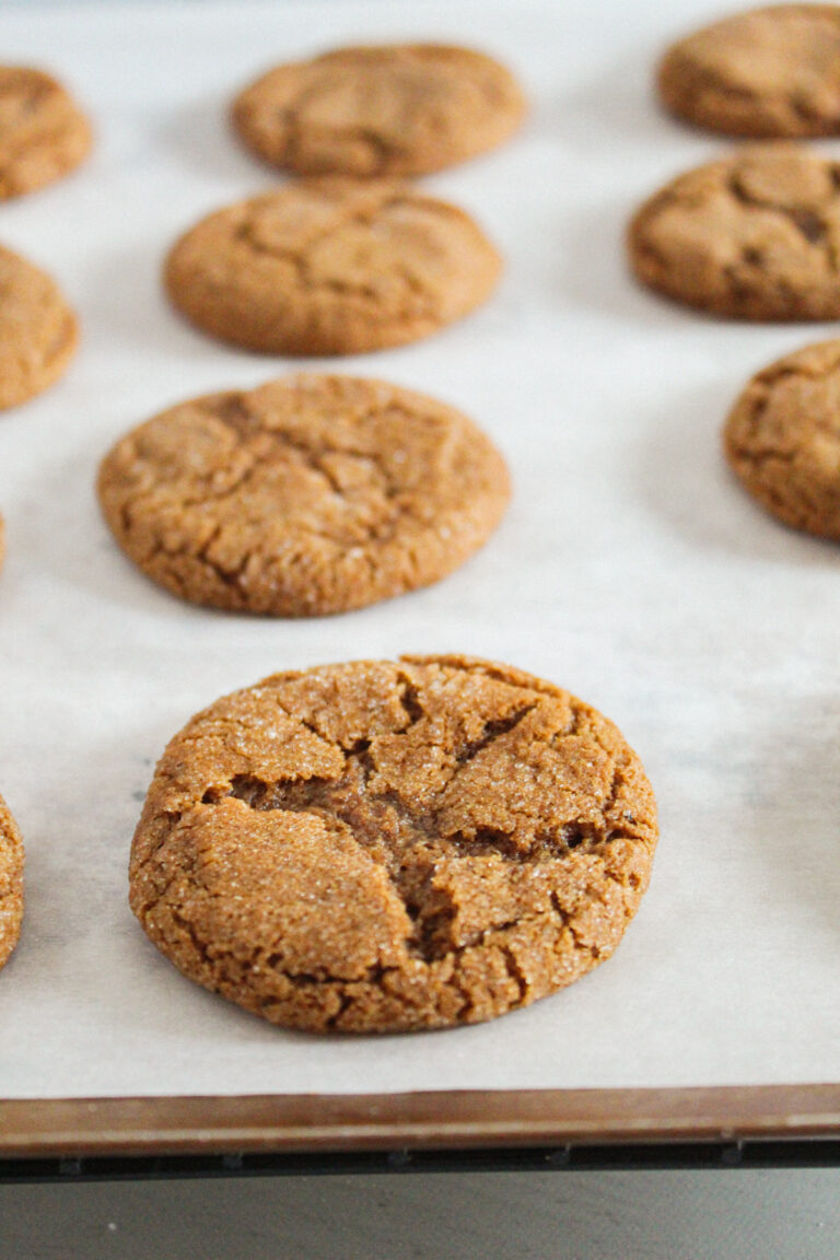 gluten free molasses cookies on a cookie sheet.