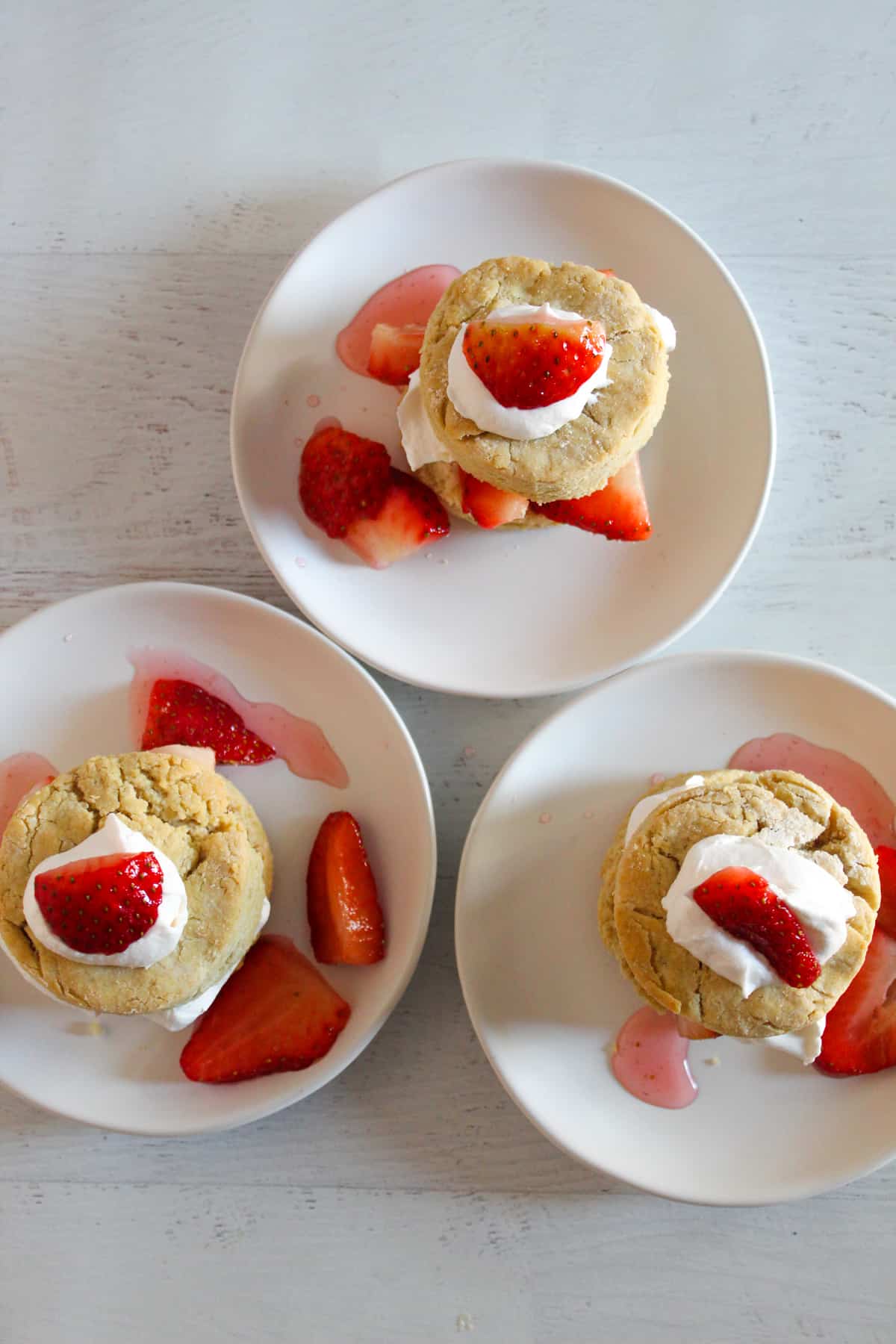 overhead shot of 3 gluten free strawberry shortcakes.