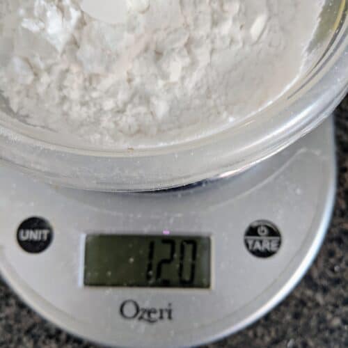 digital scale with flour weighed on it.