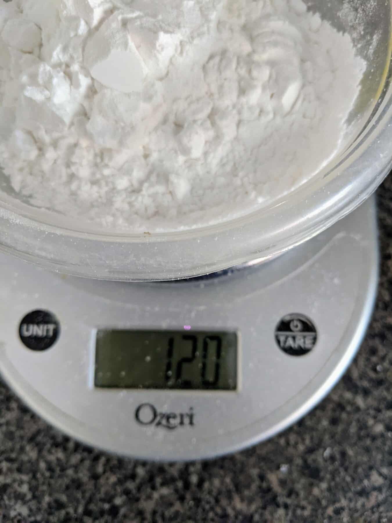 digital scale with flour weighed on it.